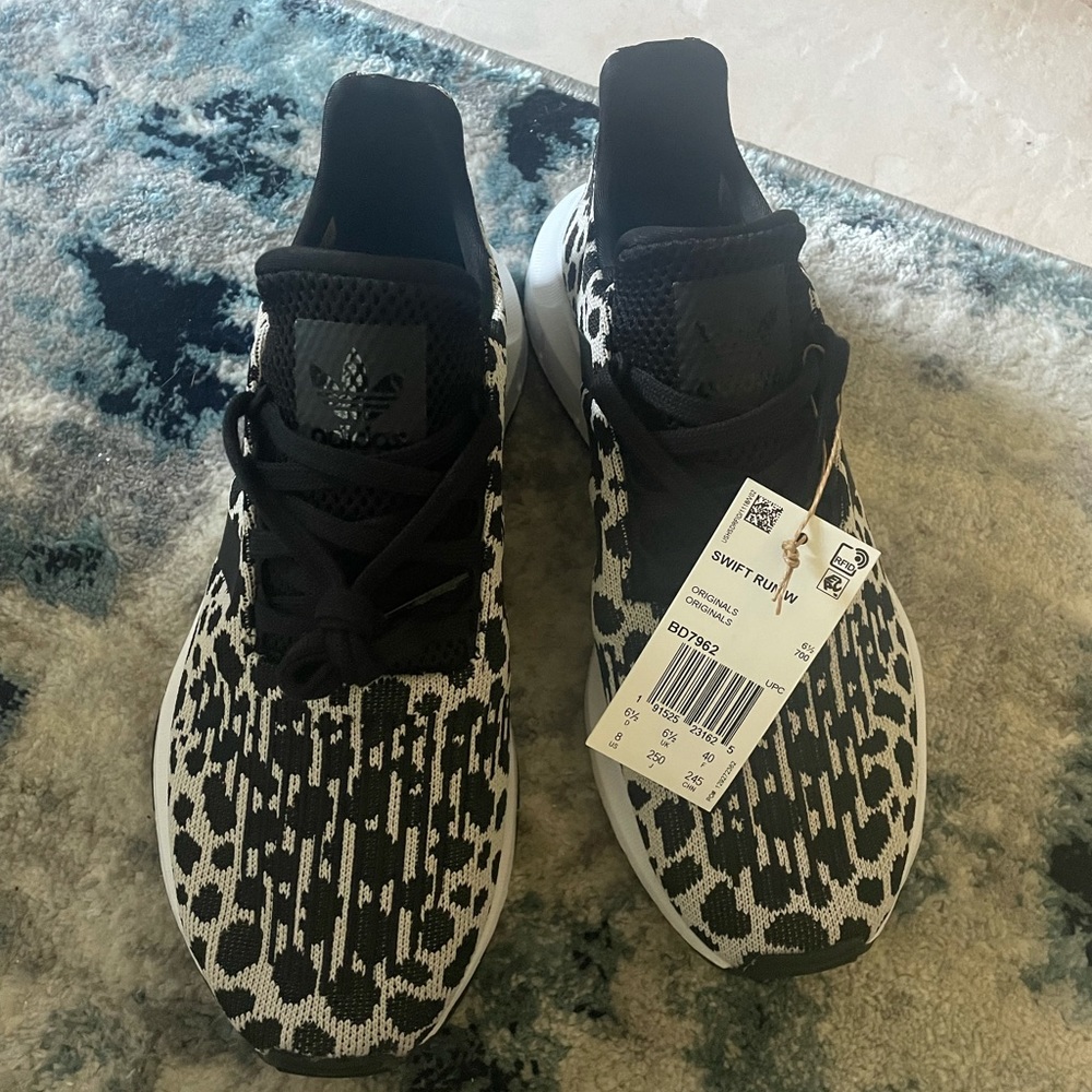 Adidas Swift Run Leopard/cheetah.  Size 7 fits like 7.5.